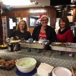 HHM Volunteers serving a warm meal to the guest of the Burkewood